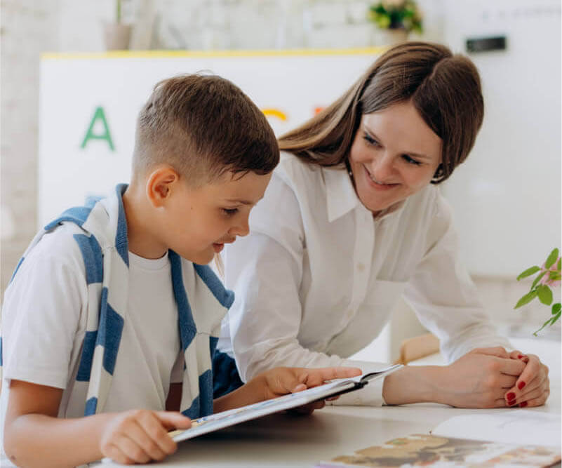 teacher and student reading in the classroom