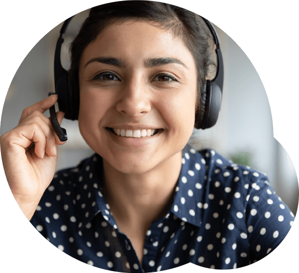 woman wearing a headset and holding the microphone of the headset, representing a dyslexia therapist